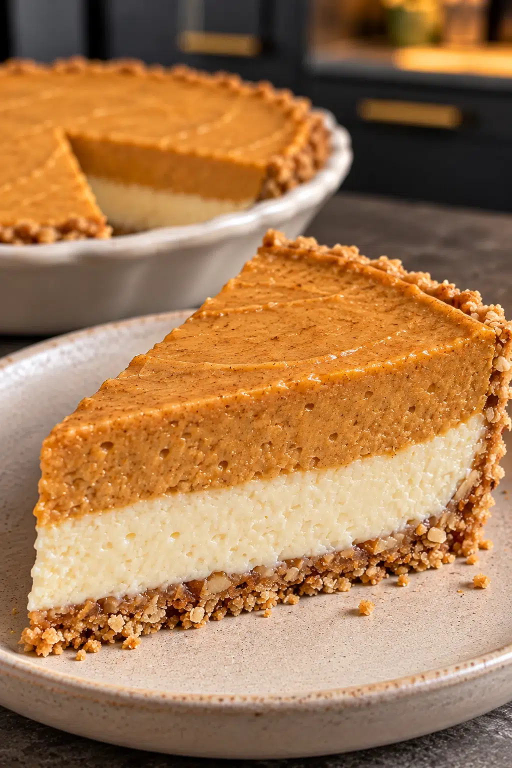 Sugar-free double layer pumpkin pie with vanilla and pumpkin layers in a speckled pan
