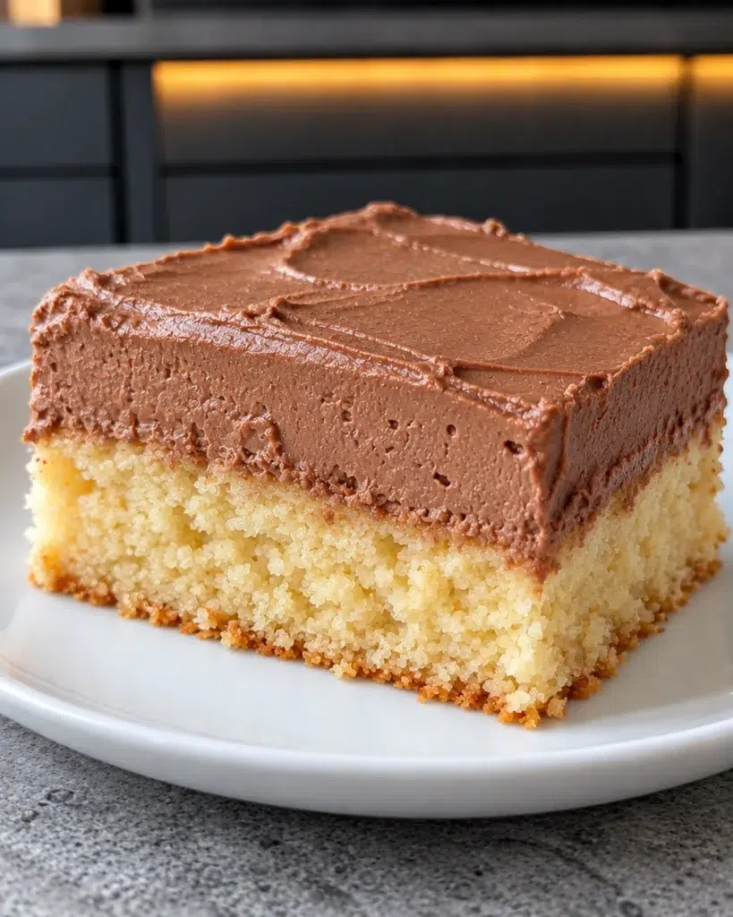 Sugar-free vanilla cake chocolate cream in thick square slices