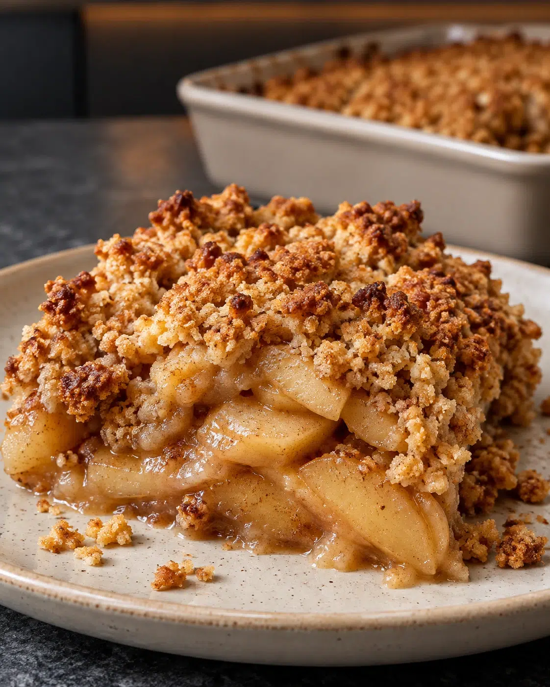 Sugar-free apple crumble: golden almond topping over soft cinnamon apples on a plate
