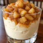 Sugar-free caramel apple cheesecake cup with creamy vanilla cheesecake and cinnamon caramel apples in a glass